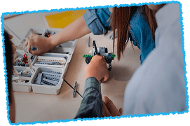 students assembling legos